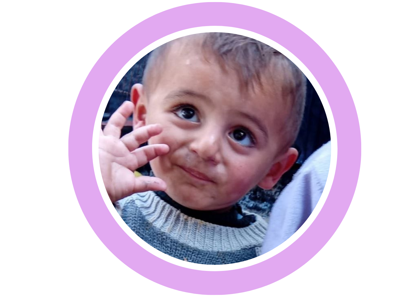 A young child waving